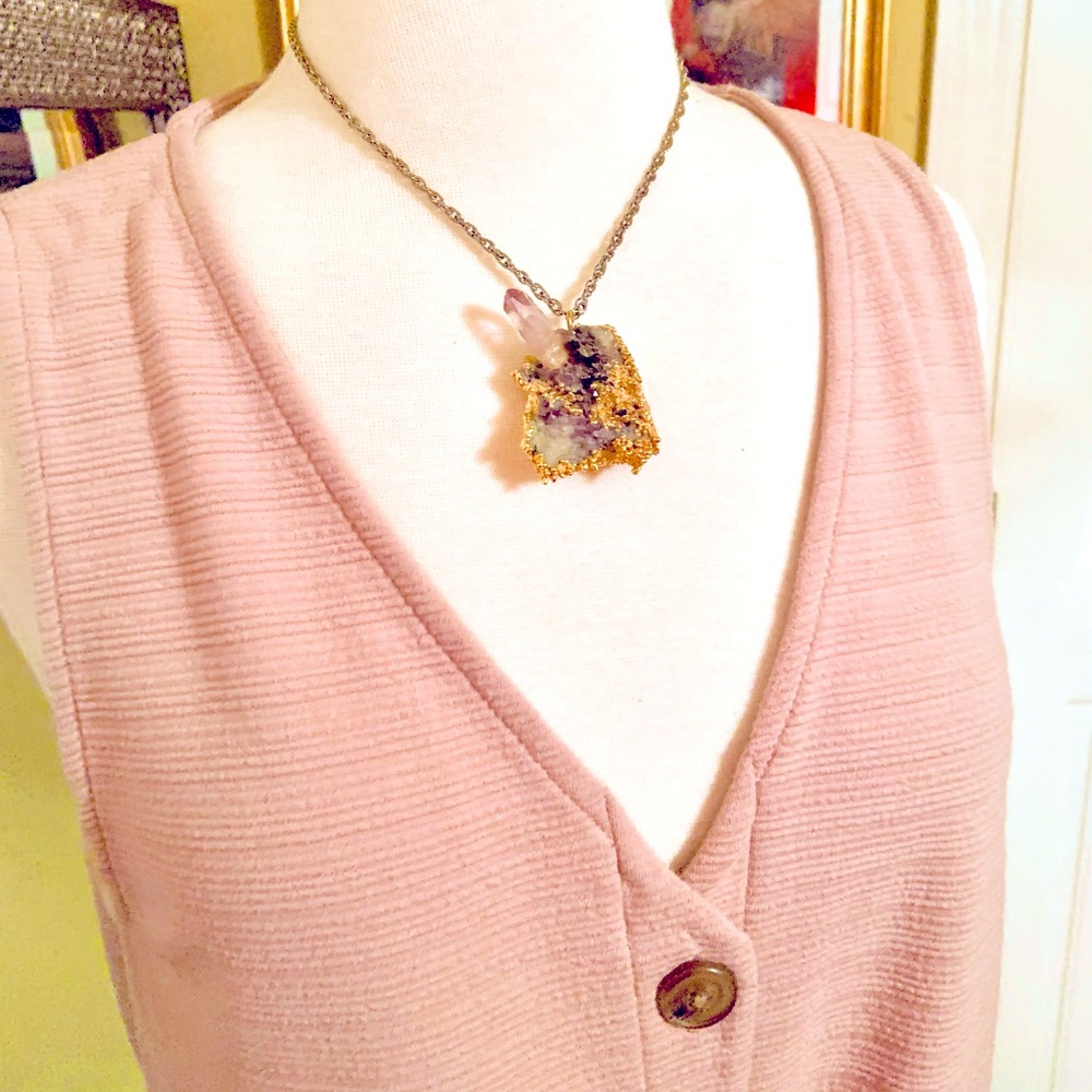 Vintage raw amethyst necklace encased in gold tone. Great condition.